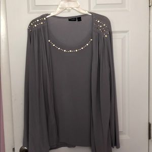 Light grey one piece top with studs.